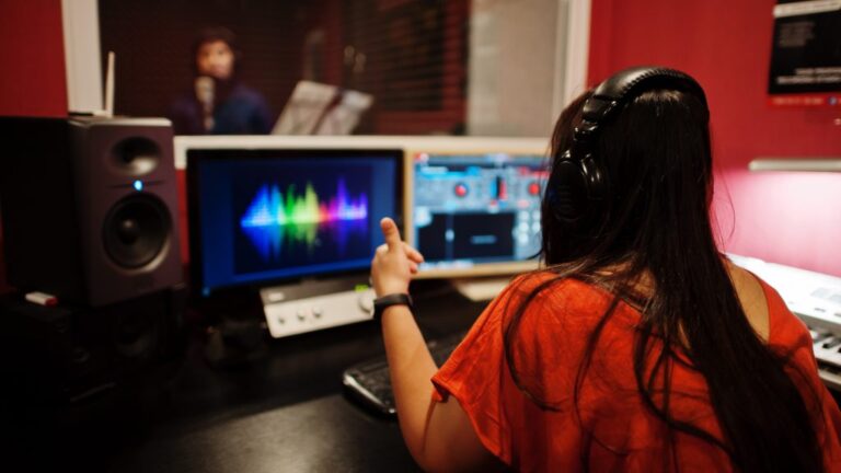 young-asian-singer-man-with-microphone-recording-song-record-music-studio-with-sound-producer-1024x576