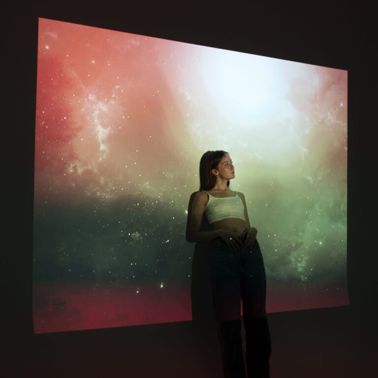 young-woman-standing-universe-texture-projection-1024x1024